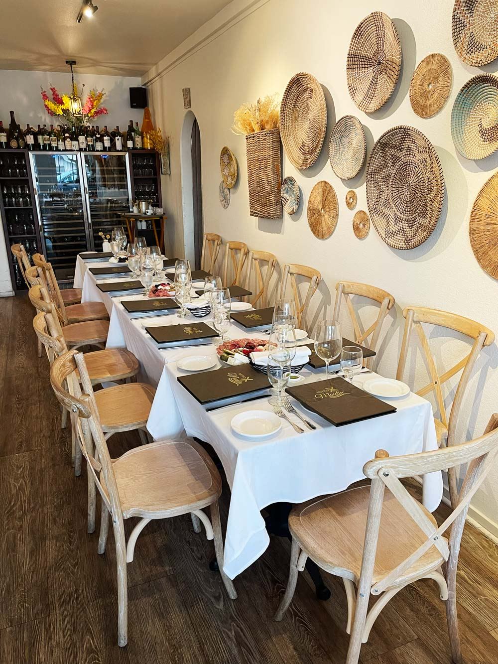 The private dining room at Bistro Moulin set with one long table