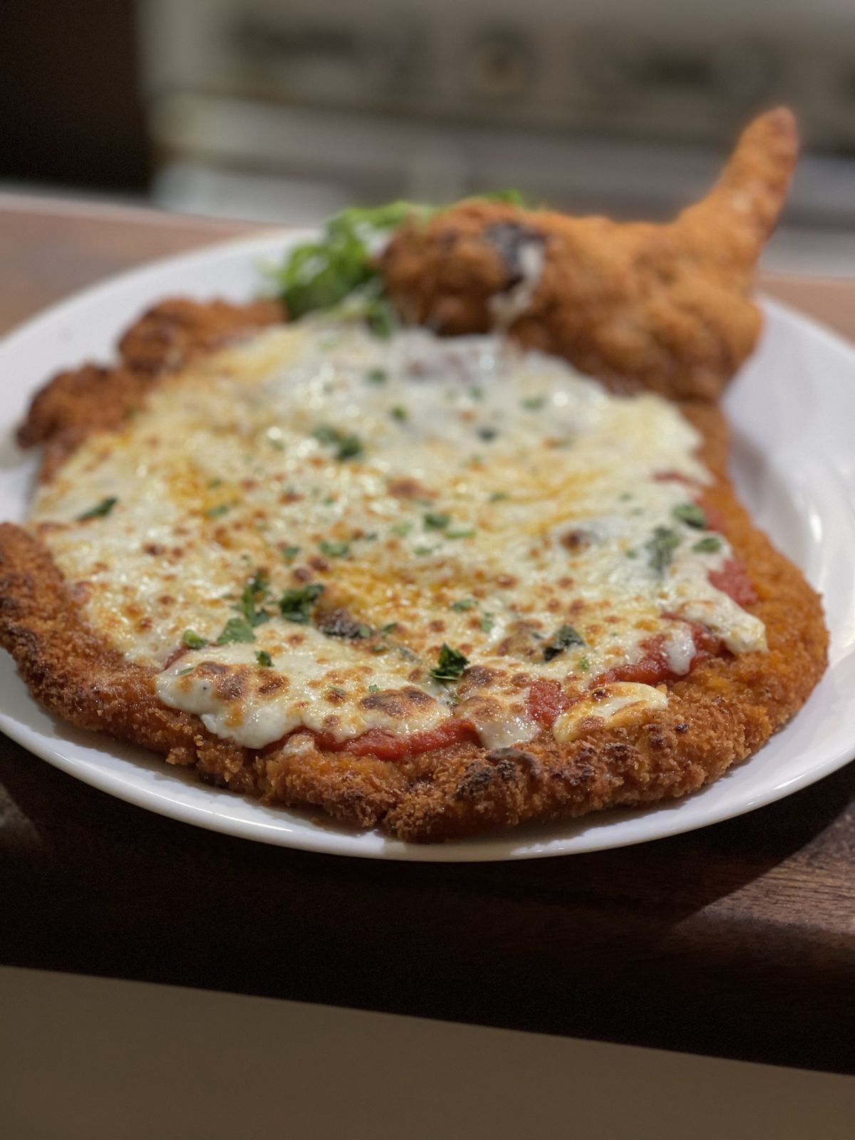 Breaded cutlet with melted cheese